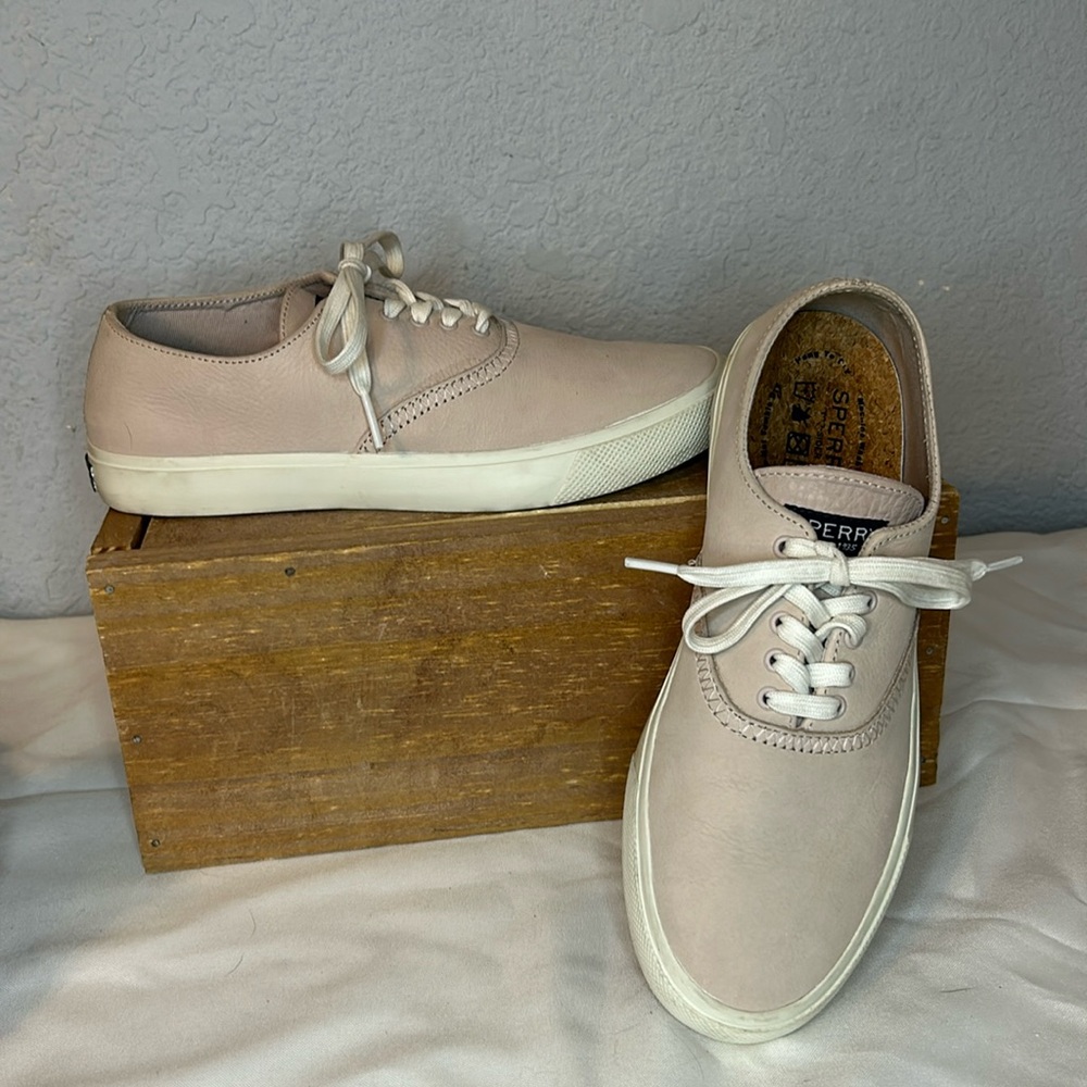Sperry lace up sneakers.